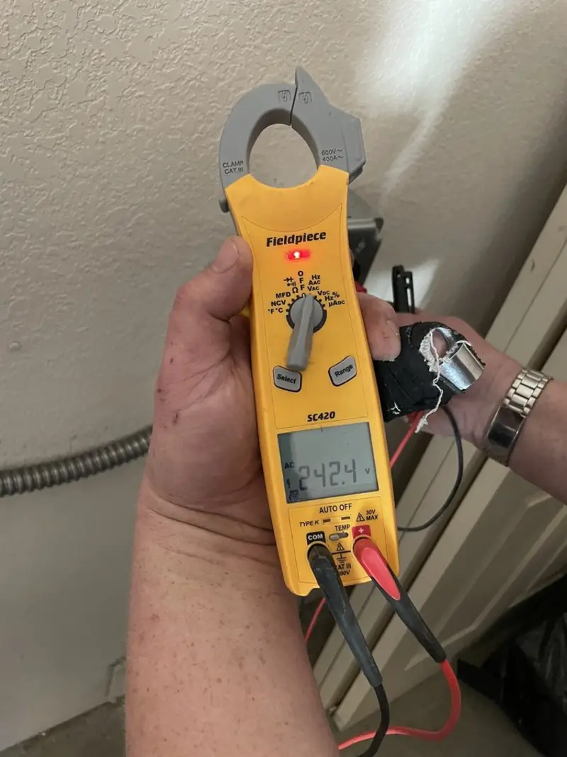 Voltage testing with clamp meter during Whole House Surge Protector in Trenton